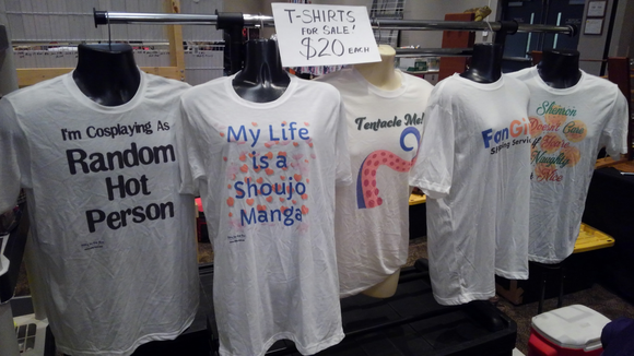 Custom designed t-shirts hanging on a sales rack ready for fanboys and fangirls to take home